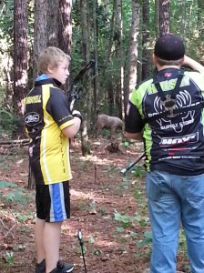 Kids shooting a bear.